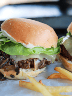 Air Fryer Mushroom & Swiss Burgers with sautéed mushrooms, melted Swiss cheese, and beef patty.