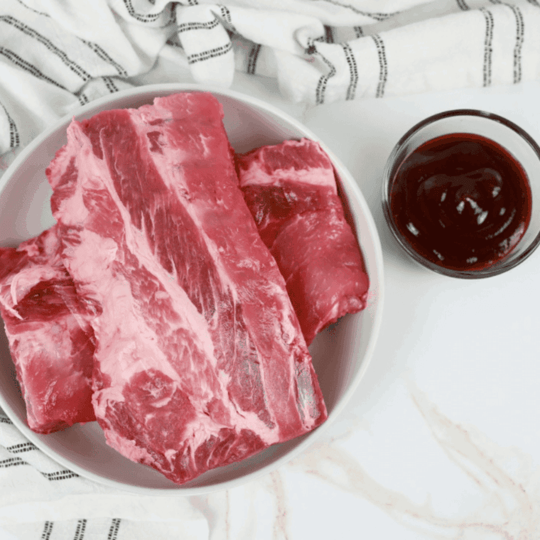 Ingredients needed for Air Fryer Pork Rib Tips on kitchen table.