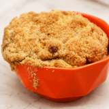 Pumpkin coffee cake baked in a white ramekin with a brown sugar streusel topping