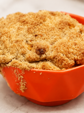 Pumpkin coffee cake baked in a white ramekin with a brown sugar streusel topping