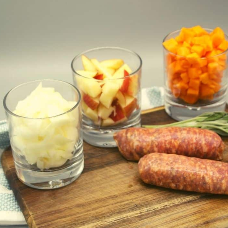 Ingredients for Air Fryer Sausages With Roasted Apples and Butternut Squash on table.