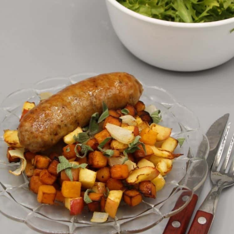 on plate, Air Fryer Sausages With Roasted Apples and Butternut Squash.