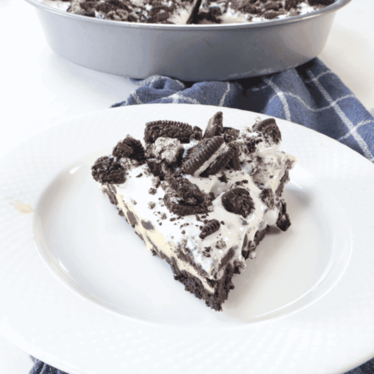 Slice of Copycat Cheesecake Factory Oreo Cheesecake with Oreo cookie crust and creamy filling.