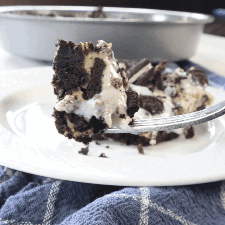Slice of Copycat Cheesecake Factory Oreo Cheesecake with Oreo cookie crust and creamy filling.
