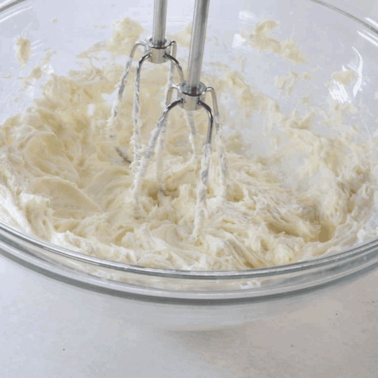  Mixing cheesecake batter with chopped Oreos in a large bowl.