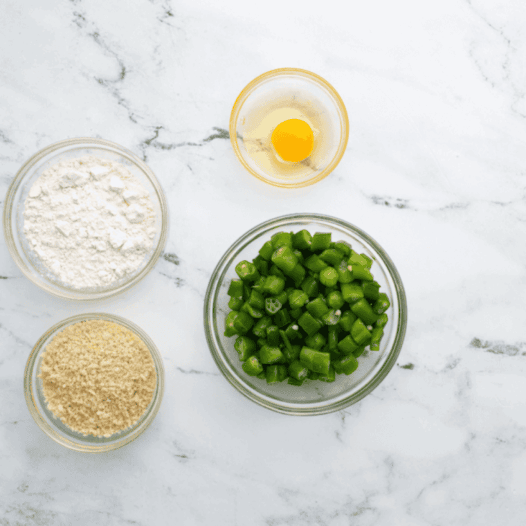 Ingredients needed for Cracker Barrel Fried Okra on kitchen table.