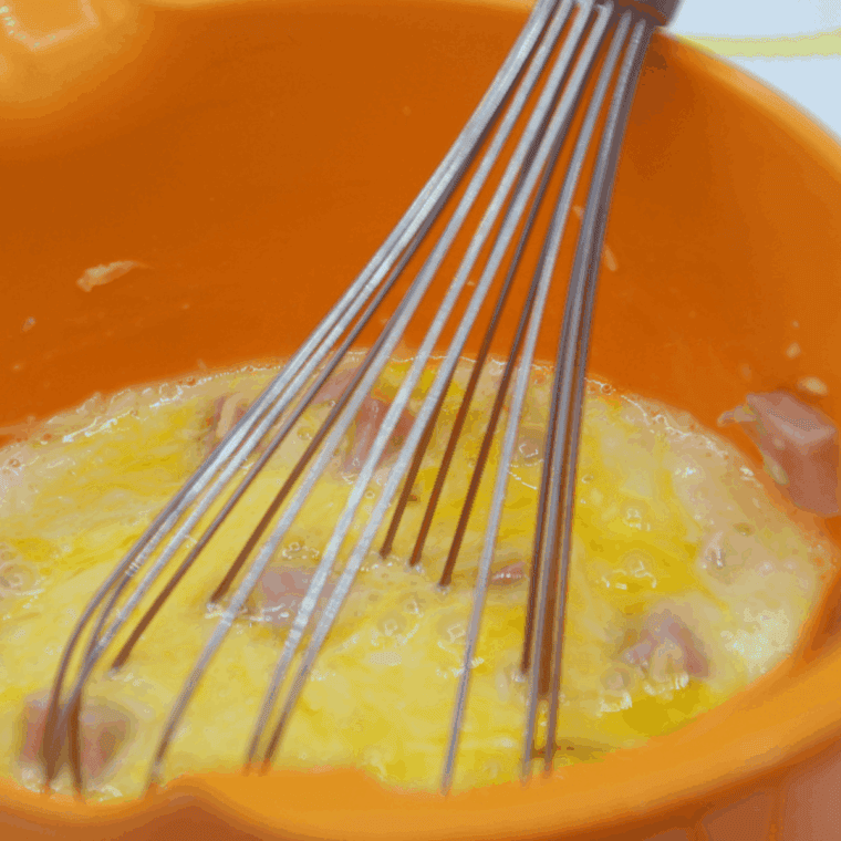 Add the ham into the egg bites, for Starbucks Ham and Cheddar Sous Vide Egg Bites. 