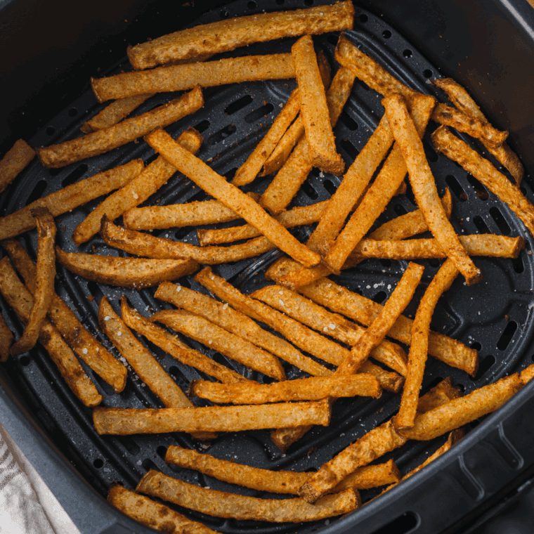 Air fryer cooking crispy golden food with little oil for quick, healthy meals.