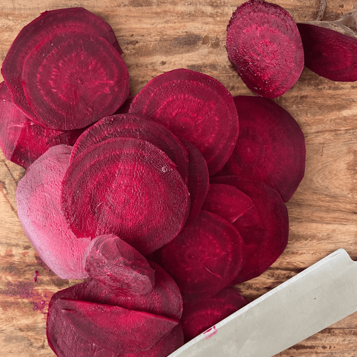 Peeling and slicing beets into thin, uniform slices for air frying.