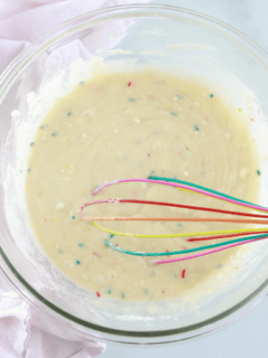 Prep the Donut Batter: In a large mixing bowl, combine the cake mix, eggs, vegetable oil, and water (add vanilla extract if using). Mix until you have a smooth batter with no lumps.