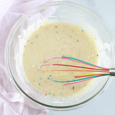 Prep the Donut Batter: In a large mixing bowl, combine the cake mix, eggs, vegetable oil, and water (add vanilla extract if using). Mix until you have a smooth batter with no lumps.