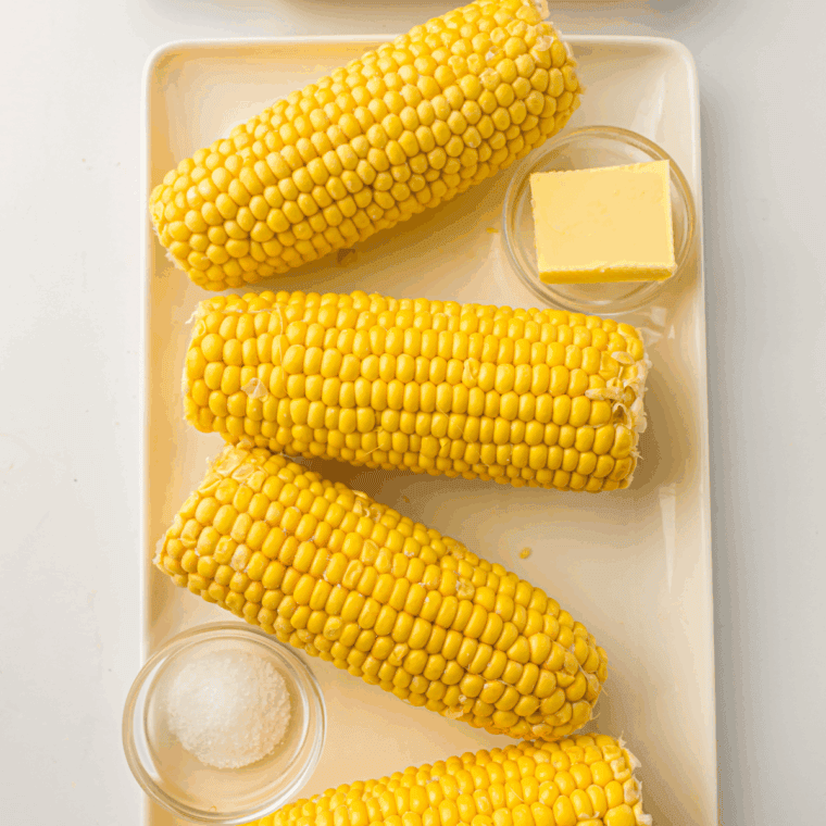 Ingredients needed for Air Fryer Corn on the Cob on kitchen table.