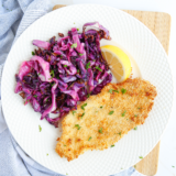 Finished Air Fryer Red Cabbage on a plate with garnish