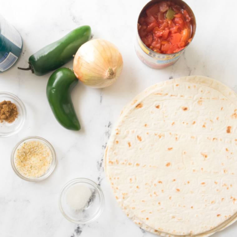 Make the chips:
Tortilla wedges crisping golden in a Blackstone air fryer drawer