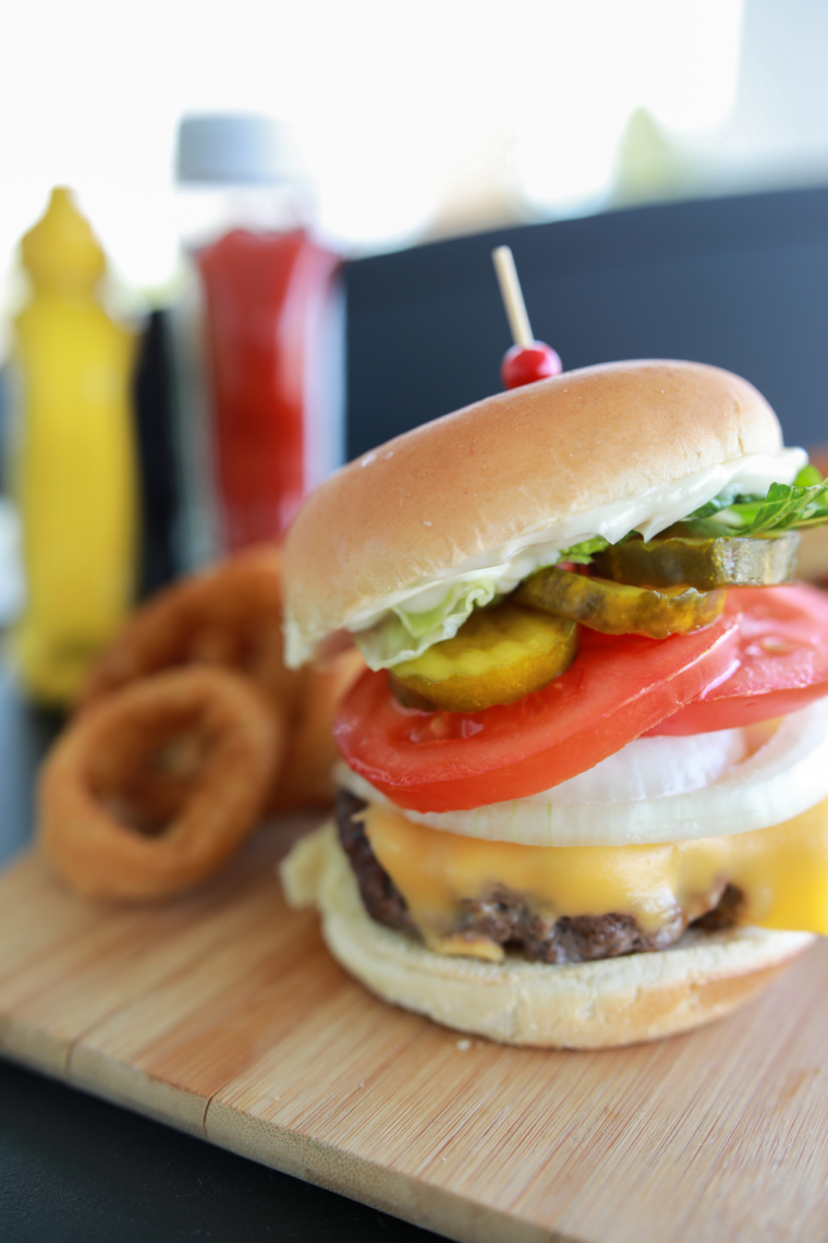 Diner-style Blackstone smash burger topped with melted American cheese