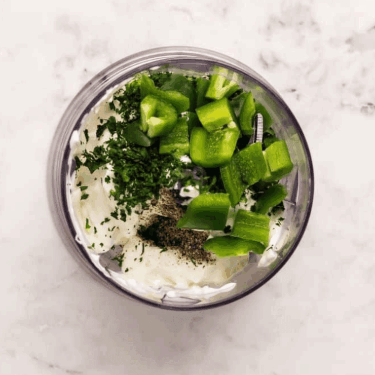 Add all of the ingredients into a food processor or blender.
