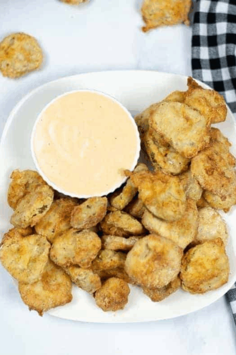 Easy air fryer Cajun fried pickles with crispy coating and spicy seasoning