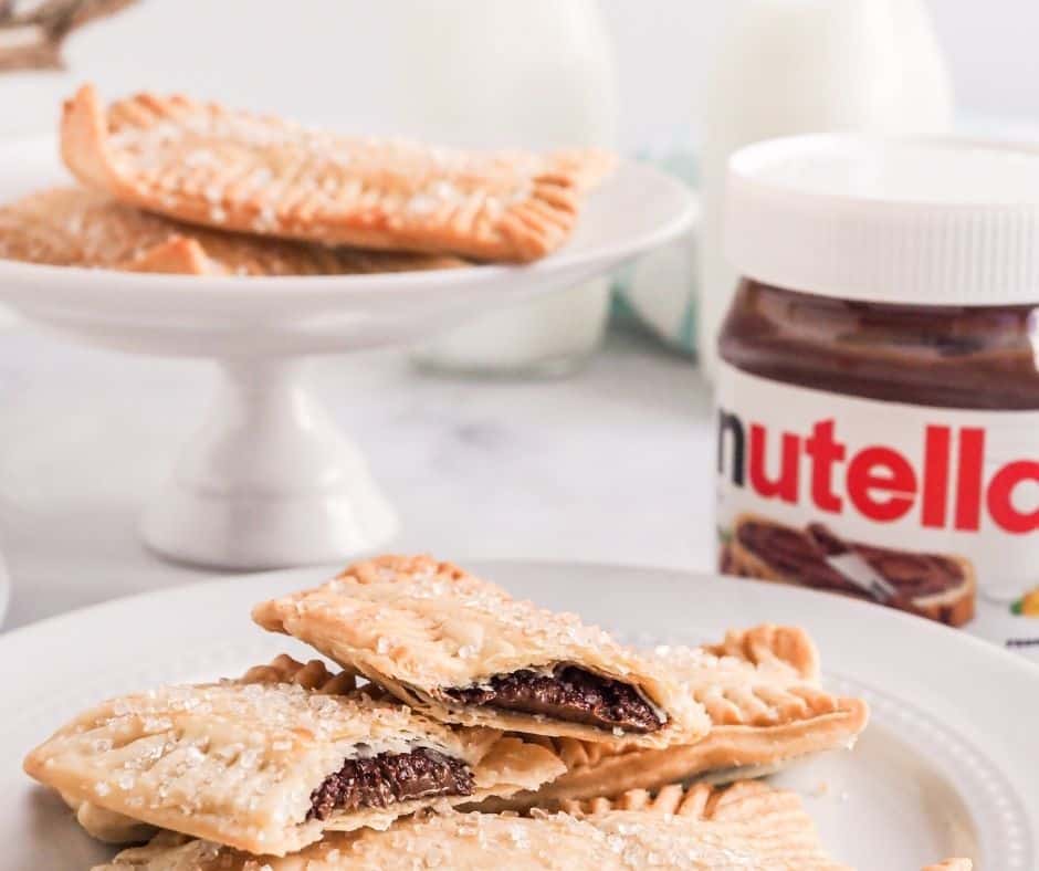 If you love the convenience of an air fryer but also crave a homemade treat, then this recipe for making Nutella Pop-Tarts in an air fryer is perfect for you! Not only does this simple yet delicious dish provide the ease and savings associated with an air fryer, it also has all of those childhood memories and delights that come with biting into a freshly made pop-tart. This quick snack can be made from basic baking ingredients and is ready to serve in under fifteen minutes; breaking down any excuses for not treating yourself to something special at home.