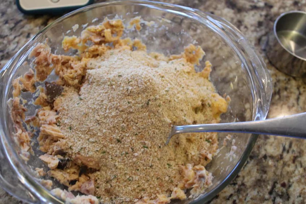 adding breadcrumbs to salmon