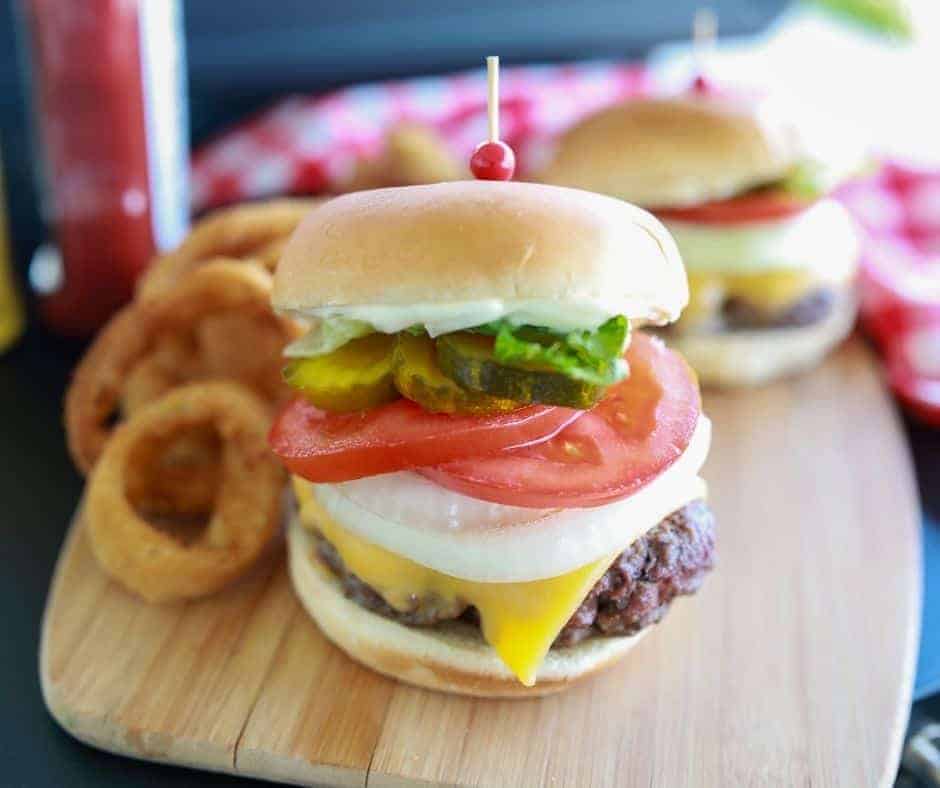 smash burger with toppings on a bun