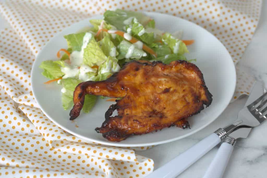 Step Three: When your chicken's internal temperature is at 165 degrees F, at the thickest part of the chicken, add your barbecue sauce, and air fry for 1-2 minutes, or until the BBQ sauce gets caramelized.

Step Four: Seve with a side of bbq sauce.