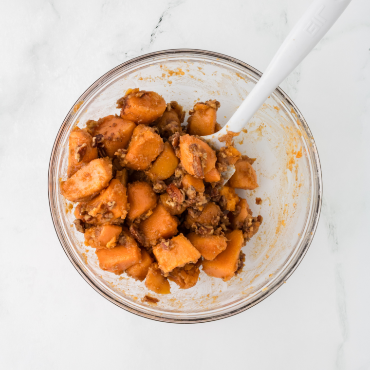 Mix Canned Sweet Potatoes with seasonings, and olive oil. Mix well, coating the potatoes.