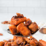 "Perfectly caramelized air fryer canned sweet potatoes in a white bowl."