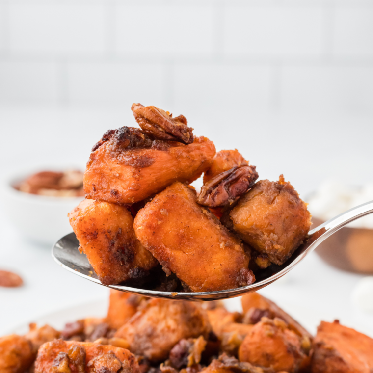 Perfectly caramelized air fryer canned sweet potatoes in a white bowl.