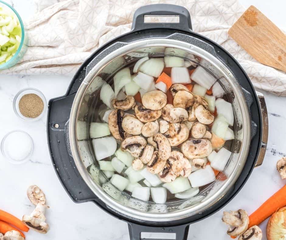 Onions, Carrots, Mushrooms, Water and Seasonings in the Instant Pot