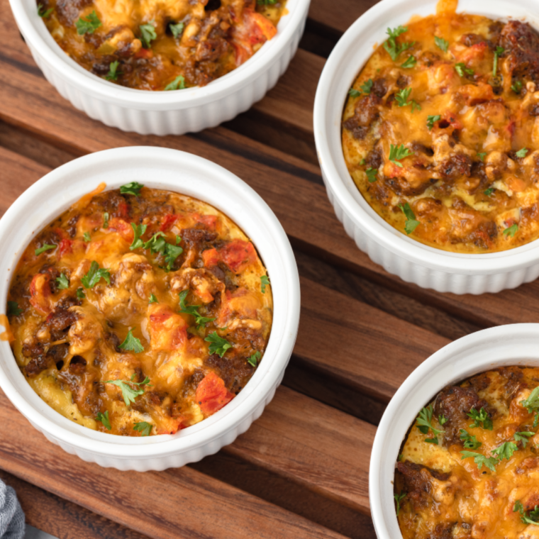 Overhead of ramekins filled with air fryer breakfast casserole