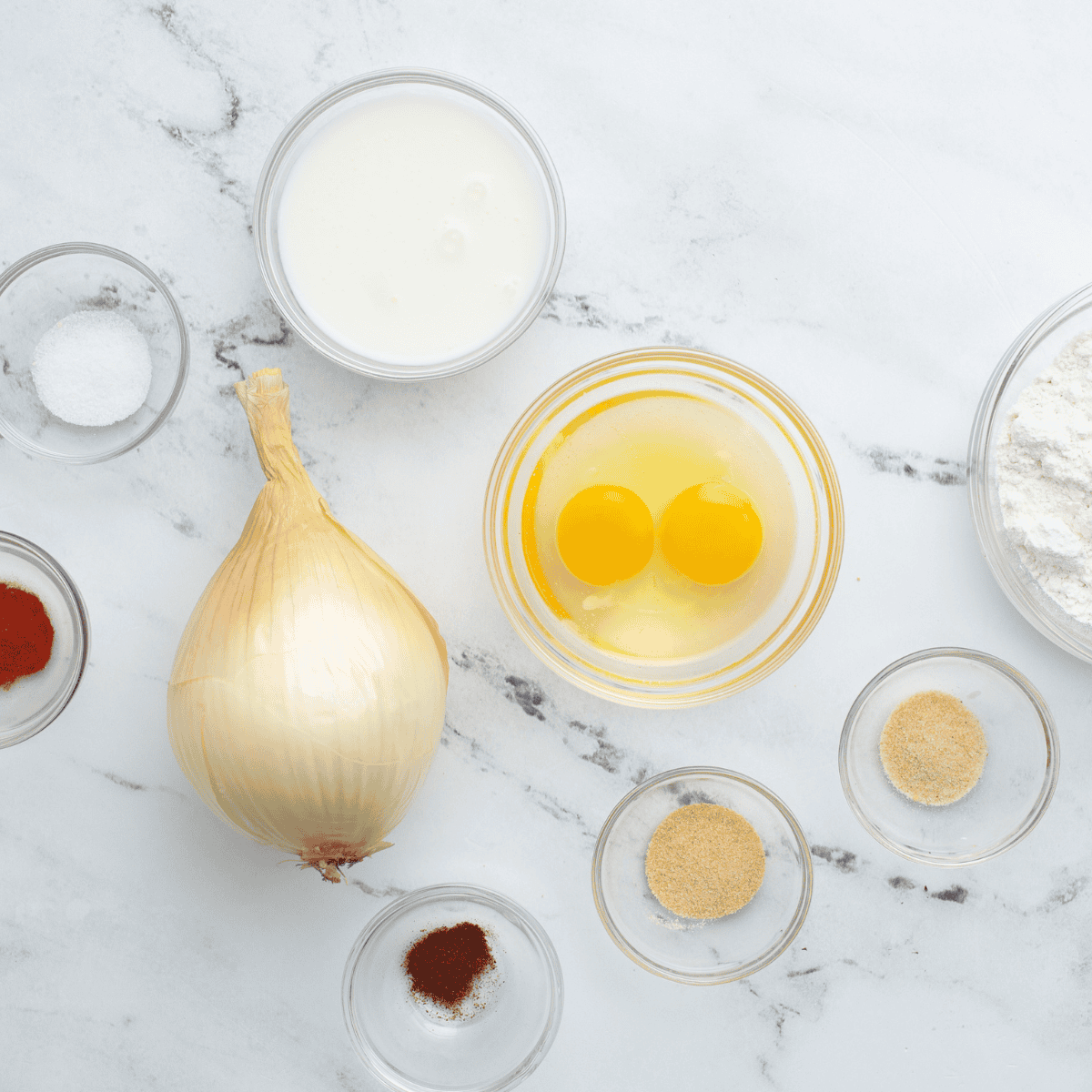 Ingredients needed for Air Fryer Gluten-Free Blooming Onion on kitchen table.