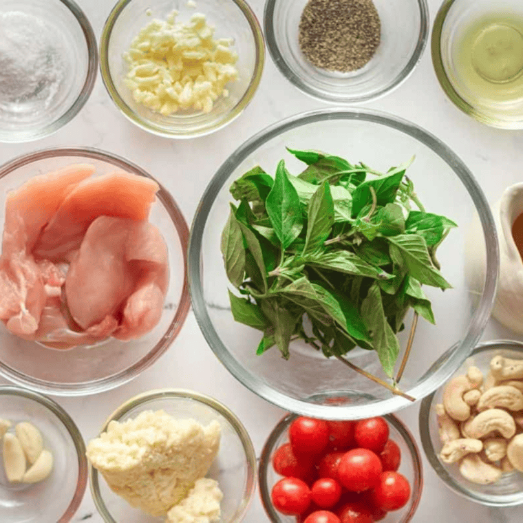 Ingredients needed for Air Fryer Pesto Chicken Tenders on kitchen table.