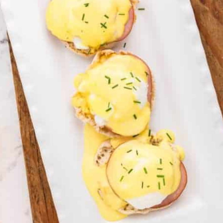 overhead: three eggs benedict made with air fryer poached eggs