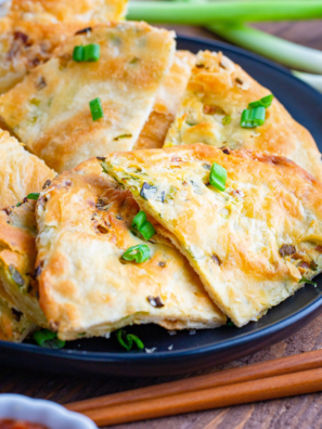 Crispy air fryer scallion pancakes with flaky layers and green onions