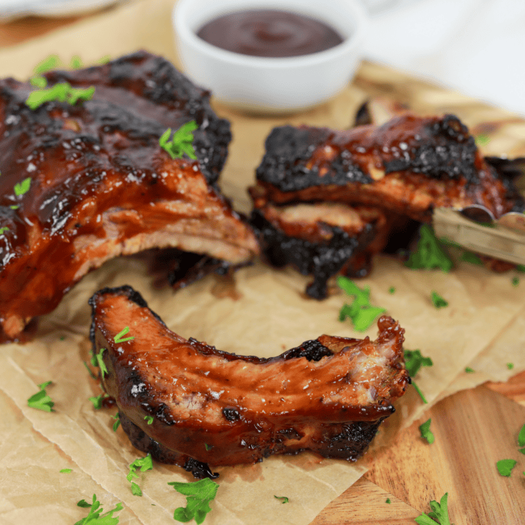 Golden-brown St. Louis style spare ribs cooked in an air fryer, glazed and ready to serve.