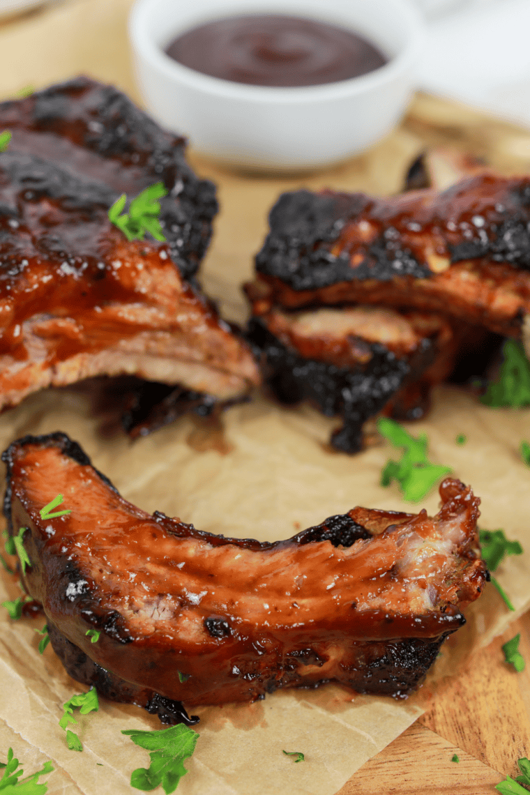 Golden-brown St. Louis style spare ribs cooked in an air fryer, glazed and ready to serve.