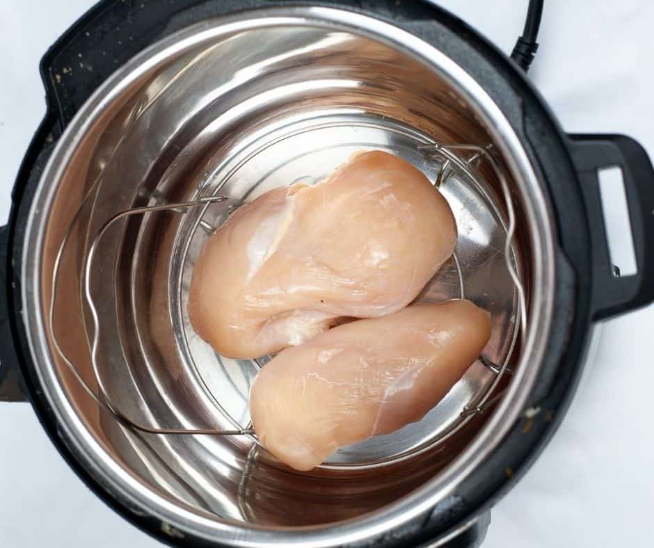 Place chicken breast in the instant pot, add 1 cup of water, and cook on high pressure for 7 minutes.