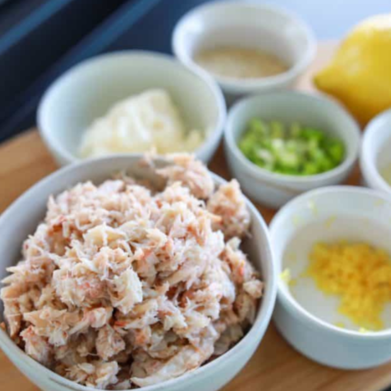 Ingredients Needed For Blackstone Crab Cakes on wooden table.