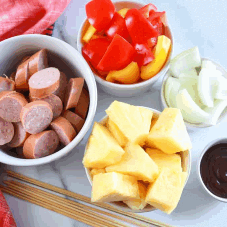Blackstone Griddle Hawaiian Kielbasa Kabobs ingredients on kitchen table.
