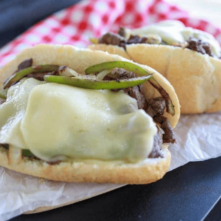 Blackstone Griddle Philly Cheesesteak -- If you have been looking for an authentic Philly cheesesteak recipe, this is the Blackstone recipe for you; prepared with the best meat and smothered with provolone cheese, this makes for the perfect meal! 