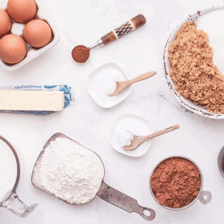 Ingredients needed for Cheesecake Factory Linda’s Fudge Cake Recipe (Copycat Version) on kitchen table.