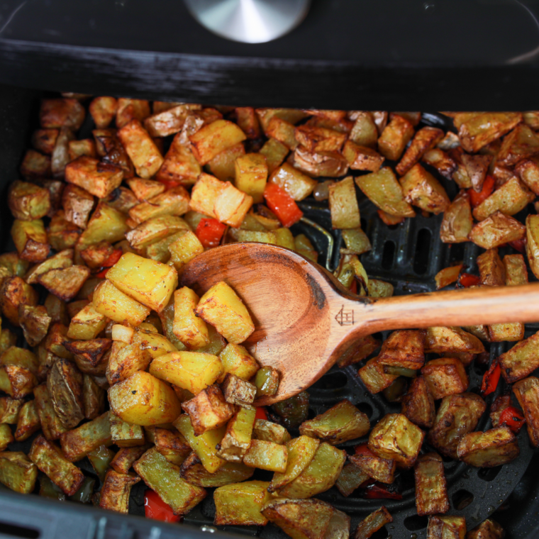 Golden crispy breakfast potatoes fresh from air fryer basket