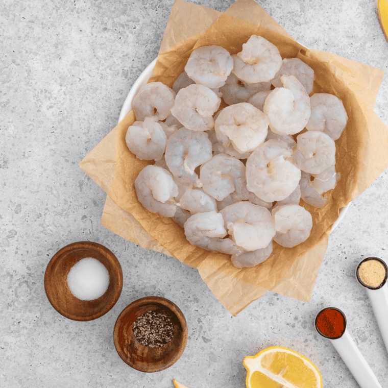 Ingredients needed for Easy Air Fryer Garlic Parmesan Shrimp on kitchen table.
