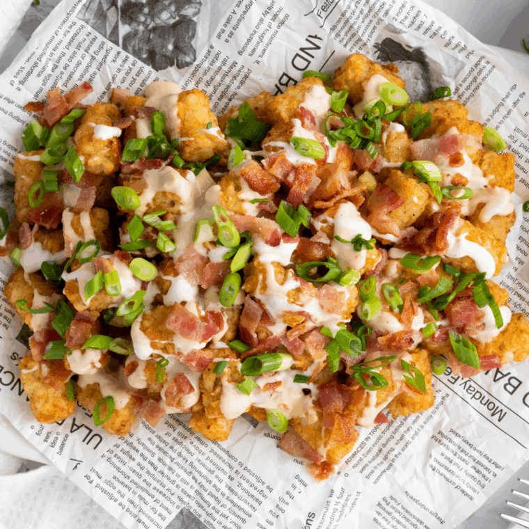Buffalo Wild Wings Tater Tots topped with ranch, green onions, and blue cheese crumbles.
