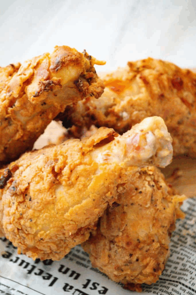 Plate of Golden Corral Fried Chicken Recipe on kitchen table.