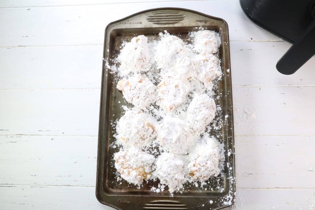 Add the cornstarch to a small mixing bowl. Using your hands form a chicken nugget (about 2 tablespoons per nugget) and then coat in cornstarch—place on a baking tray as you coat the nuggets.