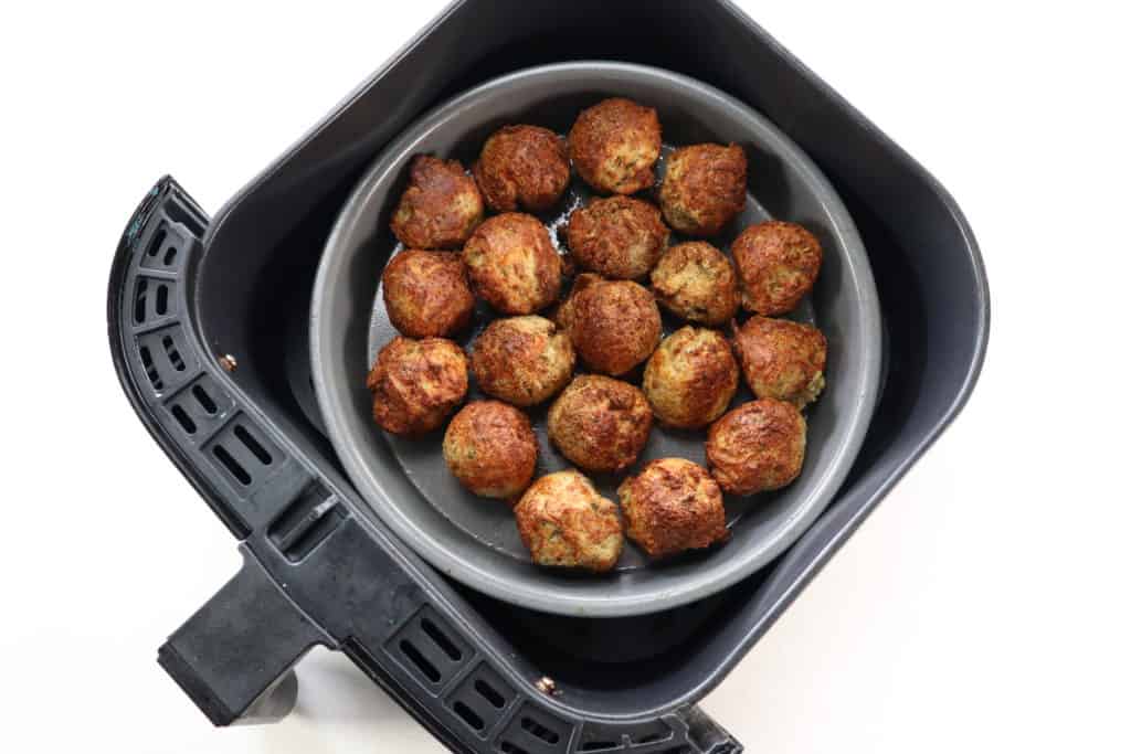 Using your hands, shape the meatballs into 1 to 2 inch balls. Either place them into a greased baking pan or place them into a greased air fryer basket. Set the temperature to 350 degrees F, air fryer setting for 10-12 minutes. Flip halfway.