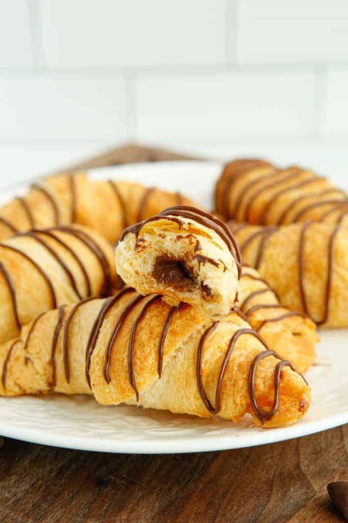 Why You Will Love Homemade Chocolate Croissants Homemade chocolate croissants, especially when made with the convenience of an air fryer, offer a host of delightful reasons to fall in love with them. Here's why they are bound to become a cherished treat in your recipe collection: Exceptional Freshness and Flavor: There's nothing quite like the taste of a freshly baked chocolate croissant. The warmth of the pastry, combined with the melting chocolate, offers a sensory experience far superior to anything store-bought. Perfect Texture: By making them at home, especially using an air fryer, you get croissants with the ideal balance of a crispy, golden exterior, and a soft, flaky interior. The direct heat of the air fryer ensures even cooking, giving you that perfect texture every time. Customizable Chocolate Choices: When you make chocolate croissants at home, you can choose your favorite type of chocolate - dark, milk, semi-sweet, or even flavored chocolates like orange or mint for a unique twist. Satisfaction of Homemade Baking: Baking something as delightful as a chocolate croissant from scratch has a unique joy and satisfaction. It’s not just about the end product but also the pleasure and accomplishment you feel in baking. Control Over Ingredients: Homemade baking allows you to control the quality of the ingredients. You can opt for high-quality butter, organic flour, and artisan chocolate to ensure your croissants are made with the best available components. Perfect for Any Occasion: Chocolate croissants are versatile – ideal for a luxurious breakfast, a delightful brunch addition, a sweet snack, or a dessert spread. They suit any mood and occasion. Cost-Effective Indulgence: Making croissants at home can be more economical than buying them from a bakery, especially catering to a family or a group of friends. Fun to Make with Family or Friends: Making croissants can be a fun and engaging activity to do with family or friends, turning baking into a social event. Convenience and Speed with an Air Fryer: Using an air fryer speeds up the process significantly compared to traditional oven baking. It’s a quick and convenient way to enjoy freshly baked goods without an oven's long preheating time and energy usage. Impressive Culinary Feat: Also, homemade chocolate croissants will impress anyone who tastes them. There's something about homemade pastries that always feels a little bit special. In summary, homemade chocolate croissants are not just delicious; they’re a journey into the world of gourmet baking right from your kitchen, offering freshness, customization, and the pure joy of baking.