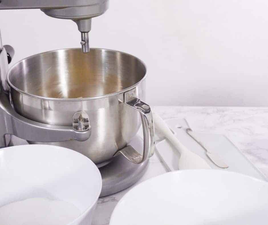 standing mixer and white bowls on a white background