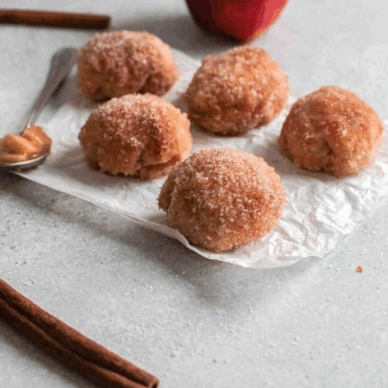 Golden, bite-sized air fryer apple pie bombs with cinnamon apple filling inside.